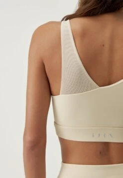 Born Living Yoga JIN - Sport-BH Mit Mittlerer Stützkraft - Oat Milk 11 Born Living Yoga JIN - Sport-BH Mit Mittlerer Stützkraft - Oat Milk -Born Living Yoga Verkäufe 3b4695b055bd4cd299c567d8847817c2
